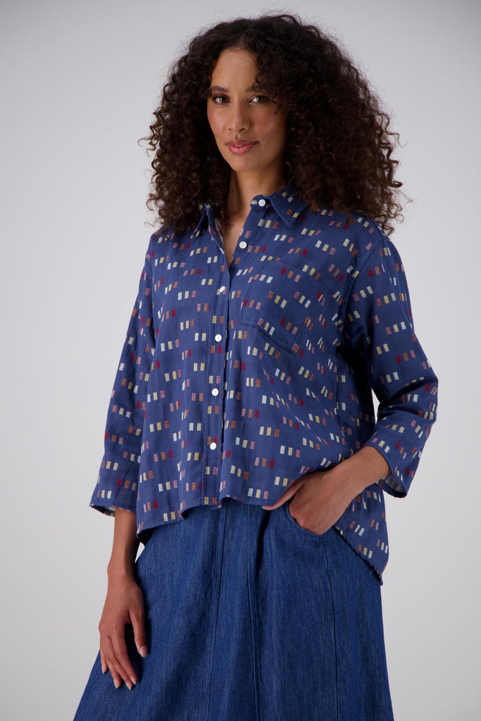 Olga de Polga classic shirt in the new Blue Telegraph woven cotton. With accents of red, yellow, cream and mauve. Front view