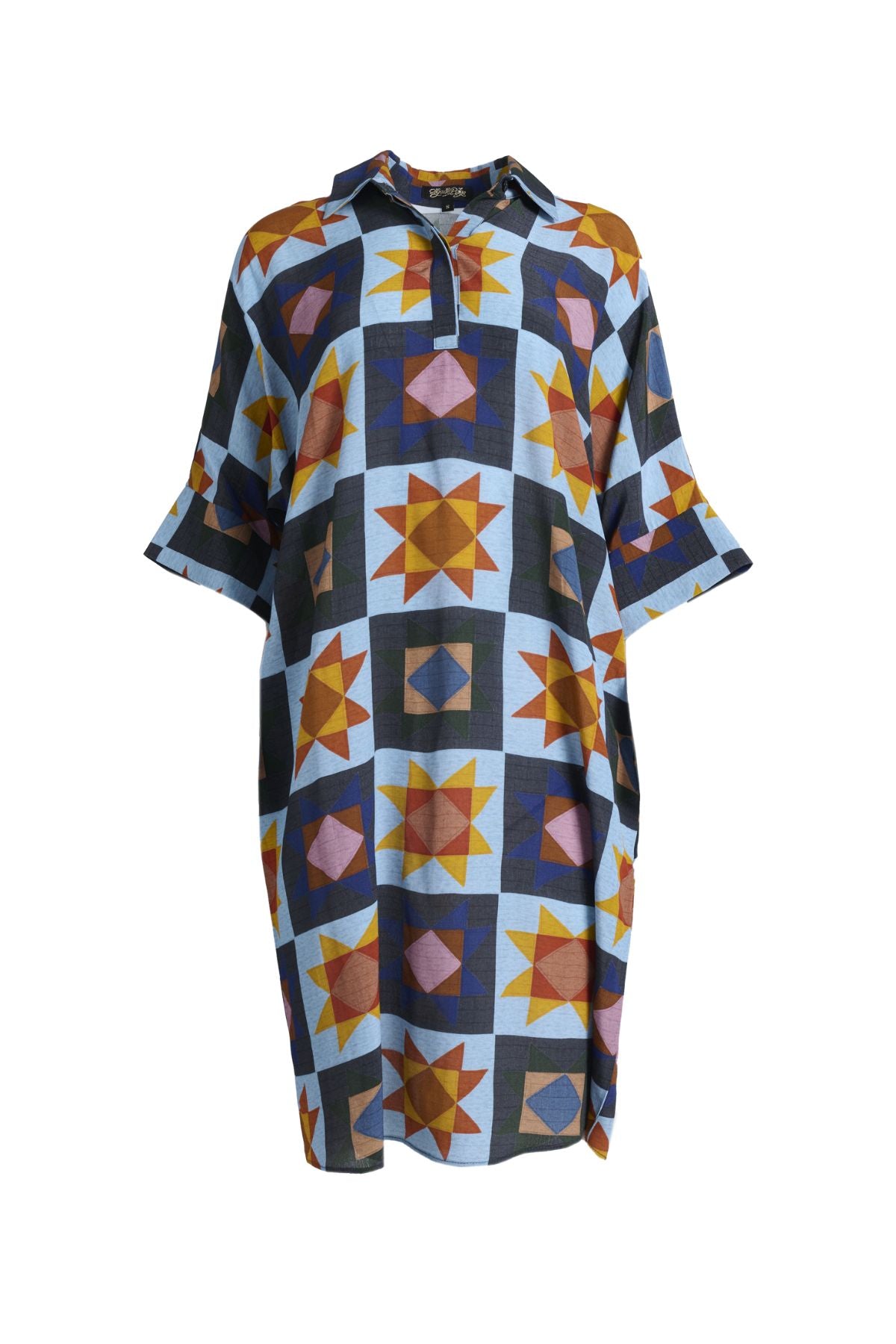 Olga de Polga Estilo shift dress in the Veda Day blue print. Classic shift silhouette with a flattering collar and half sleeves.Front button opening at neckline.Slouchy batwing sleeves.Finishes at the knee, depending on height. Front view