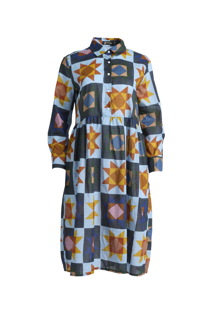 The Sienna Dress is a long-sleeve version of our classic Villa dress, perfect for cooler days or those who prefer arm coverage. Designed with a relaxed, loose fit, it features a collar and button-front opening, leading to a gathered waist for added shape. The full-length sleeves have cuff and button closures, offering the option to roll them up for a more casual look. Front view