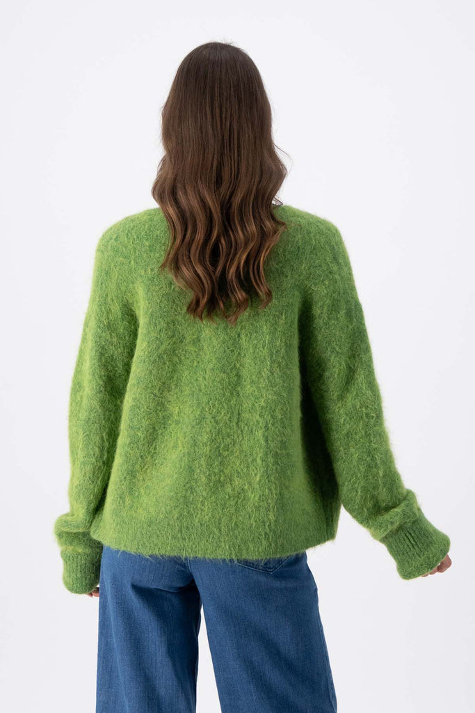 Olga de Polga Green alpaca In Transit short cardigan. With a button front and long sleeves.  Back view