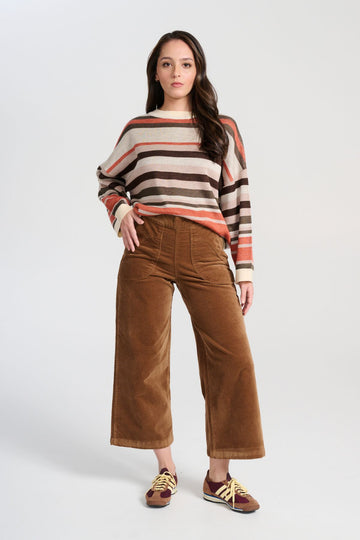 Olga de Polga brown Peggy Paris Pants Cafe in soft velvet. Original cropped length with large front patch pockets. Front view on model. 
