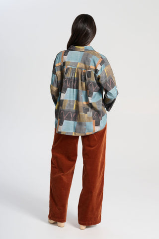 Olga de Polga Peggy Lou long pants in Caramel velvet corduroy. Crafted from a luxurious blend of 97% cotton and 3% spandex, our Velvet Corduroy offers the perfect balance of structure and softness. Back view on model