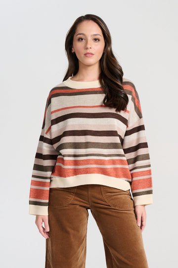 Olga de Polga Brown Earth Colorado Knit sweater with stripes in earthy colours of cream, coral, beige and brown. Long sleeves, dropped shoulders, round neckline. Front close-up view on model.