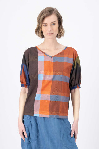 Olga de Polga Camisa Blouse in Jada printed cotton. New reversible blouse with a soft v-neck or boatneck depending on how you prefer to wear it. Half sleeves with an elasticated cuff. Batwing shaped sleeves. Tapers in at the hip. Front view on model.