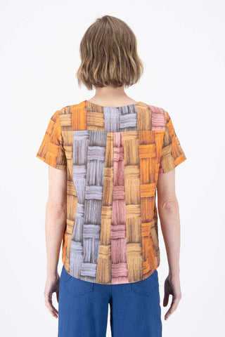 Olga de Polga top in Matador printed cotton seersucker. Short sleeves, round neck, boxy fit. back view on model.