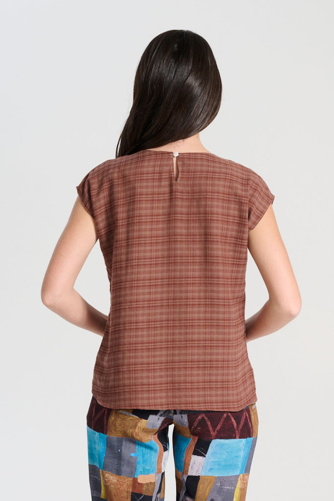 Olga de Polga Ella tee in brown Mocha brushed cotton seersucker. Cap sleeves, round neckline, tapers in at the waist. Back view on model