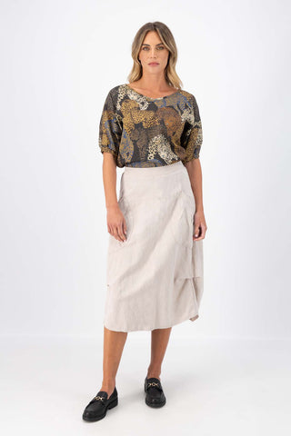 Olga de Polga Camisa blouse in Sabana printed fine Tencel. Reversible top with a soft v-neck on one side and a boatneck on the other. Half sleeves. Tapers in at the waist. Front full length view on model.