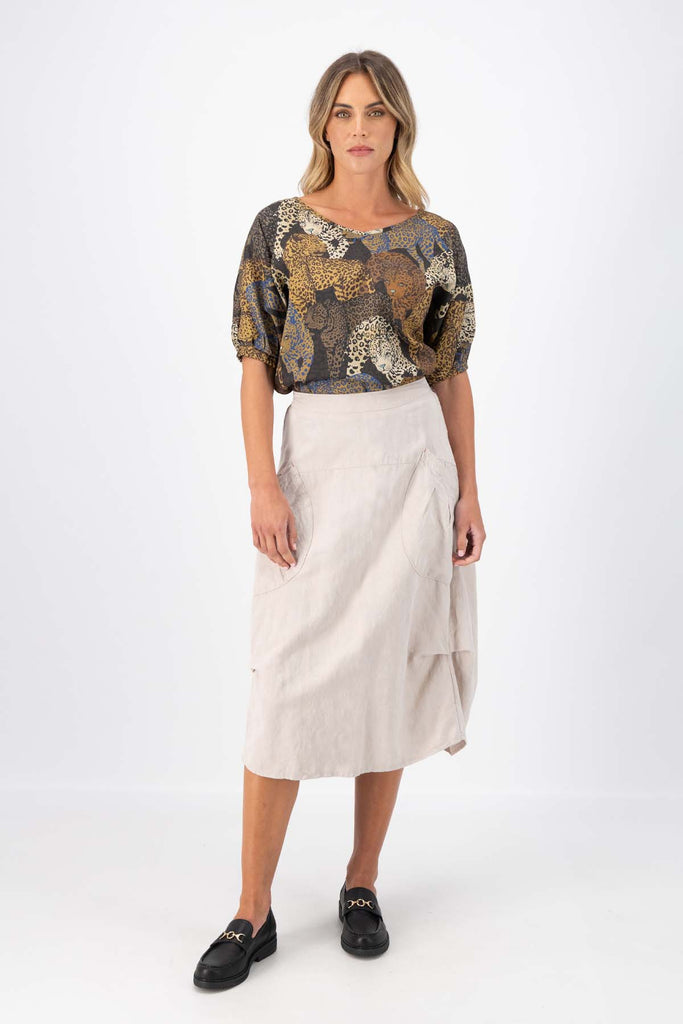 Olga de Polga Camisa blouse in Sabana printed fine Tencel. Reversible top with a soft v-neck on one side and a boatneck on the other. Half sleeves. Tapers in at the waist. Front full length view on model.