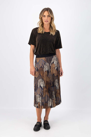 Olga de Polga Sabana pleated skirt in 100% recycled polyester. Fully elasticated waistband. Midi length. Front full view on model.