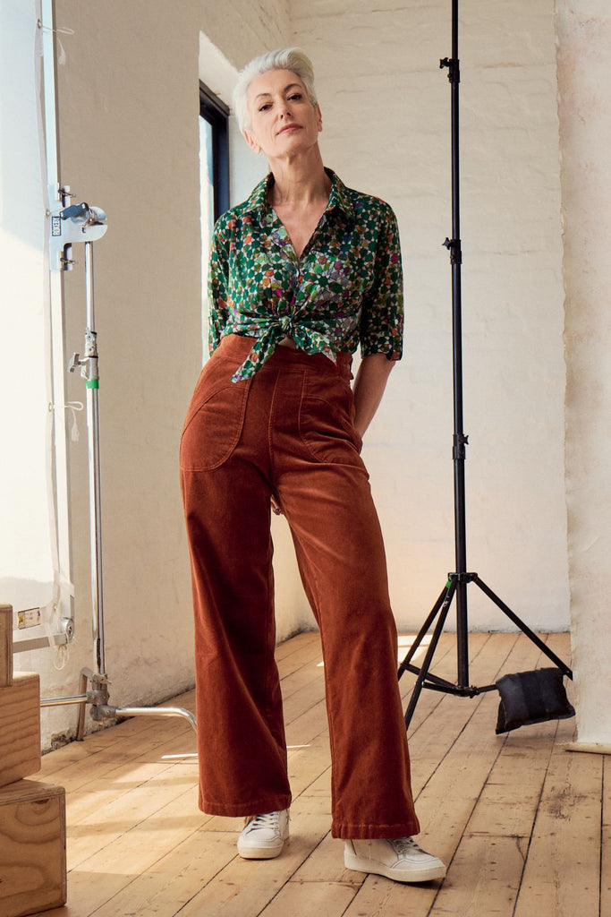 Olga de Polga Peggy Lou long pants in Caramel velvet corduroy. Crafted from a luxurious blend of 97% cotton and 3% spandex, our Velvet Corduroy offers the perfect balance of structure and softness. Front view on model