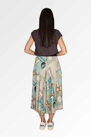 Olga de Polga pleated skirt in the Sydney Print. Cream and turquoise nautical print. Fully elasticated waistband. Back view on model