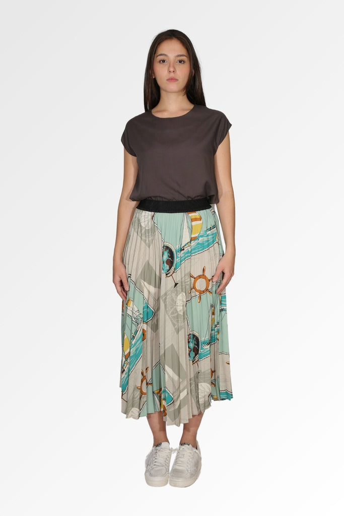 Olga de Polga pleated skirt in the Sydney Print. Cream and turquoise nautical print. Fully elasticated waistband. Front view on model.