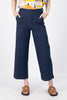 The Ligera Peggys in summer denim are crafted from a soft, stretchy, lightweight denim.
They feature a high waist, flat front, wide leg and oversized front pockets. There is an invisible zip and button fixture on the side and elasticised waistband at the back for extra comfort. Front close-up view on model.