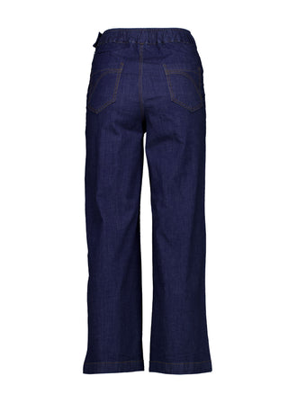 The Ligera Peggys in summer denim are crafted from a soft, stretchy, lightweight denim.
They feature a high waist, flat front, wide leg and oversized front pockets. There is an invisible zip and button fixture on the side and elasticised waistband at the back for extra comfort. Back view.