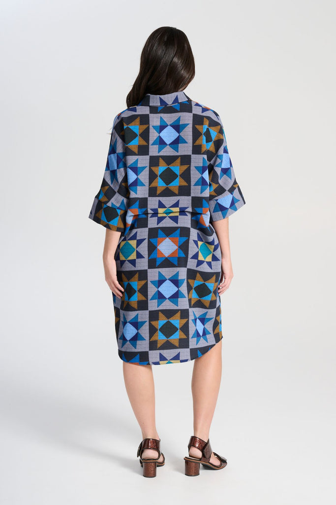 Olga de Polga Estilo dress in Veda Night printed heavy crepe. Shift dress with a collar and button front at the neck. Half sleeves. Finishes at the knee depending on height.  Back view