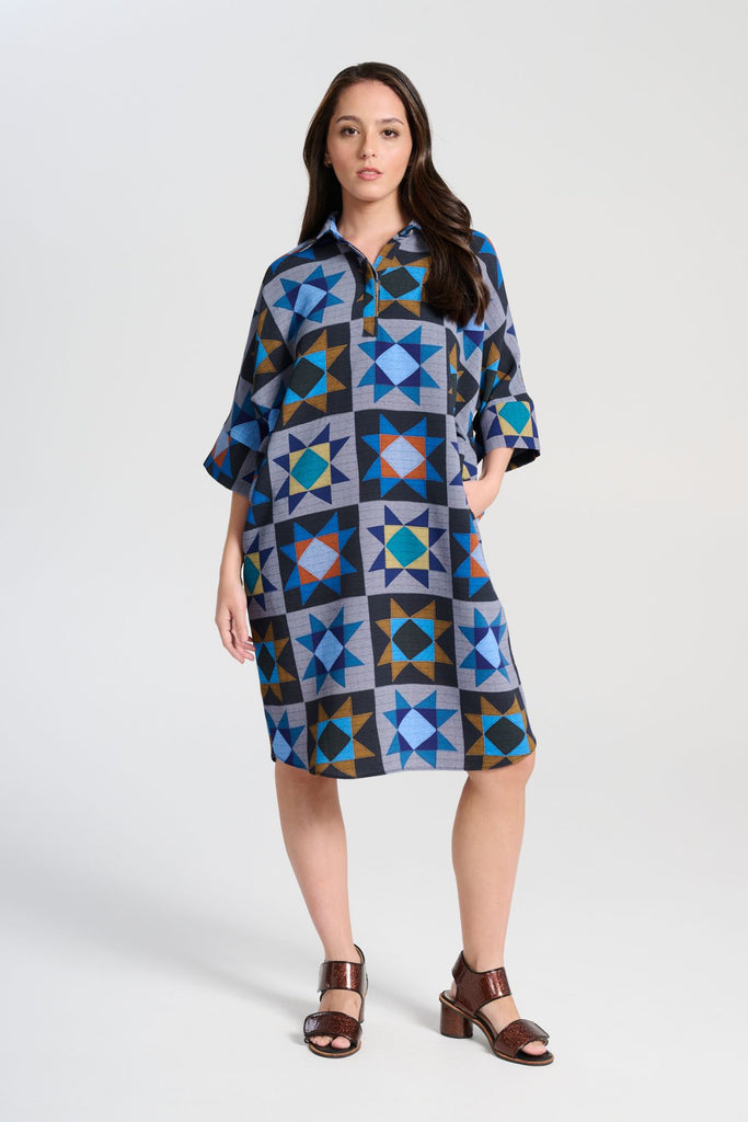 Olga de Polga Estilo dress in Veda Night printed heavy crepe. Shift dress with a collar and button front at the neck. Half sleeves. Finishes at the knee depending on height. Front view on model.