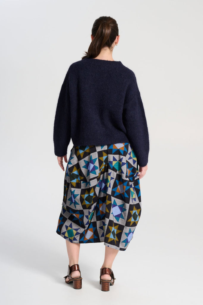 Olga de Polga Veda Milwaukee Skirt.  Comfy waistband making it the perfect throw-on-and-go!  Back view on model.