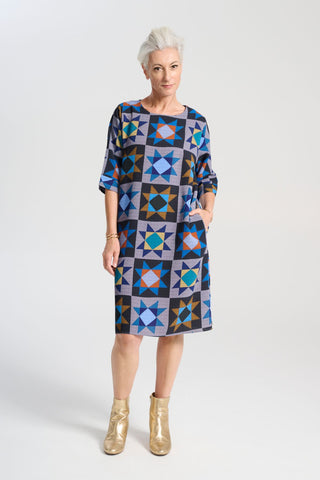 Olga de Polga Sencillo dress in Veda Night printed heavy crepe. Shift dress with half sleeves and a round neckline. Finishes at the knee depending on height. Front view on model