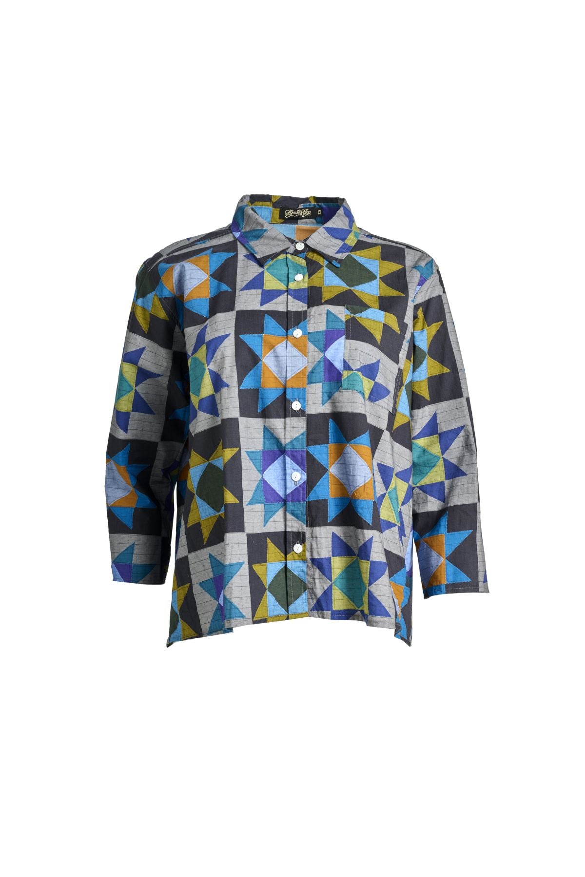 Olga de Polga Veda Shirt in Night printed cotton. Front view on model. It has an effortlessly chic, relaxed silhouette that drapes with ease. Leave it loose or tuck it in - the choice is yours.The front of the shirt sits at the waist while the back falls to the hips for a lovely drape. Front view