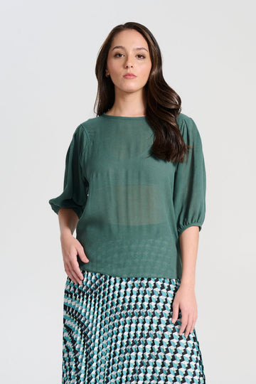 Olga de Polga Ava blouse in Forest Green viscose crepe. A mid-wight viscose crepe with a beautiful drape.  Wide neckline, half length lantern sleeves. Unique armhole shape. Front view on model.
