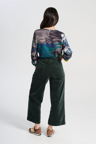 Olga de Polga Peggy Paris pants in soft cotton velvet. Cropped length. Large pockets, super comfy waistband and side zip. High waisted and very flattering on all body types. Back view on model