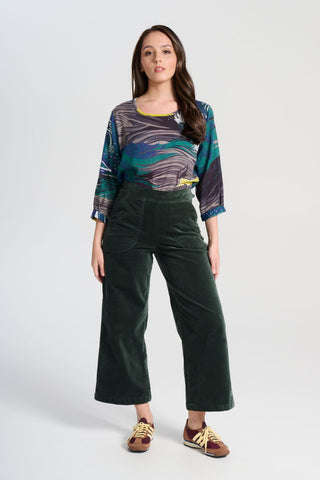 Olga de Polga Peggy Paris pants in soft cotton velvet. Cropped length. Large pockets, super comfy waistband and side zip. High waisted and very flattering on all body types. Front view on model.
