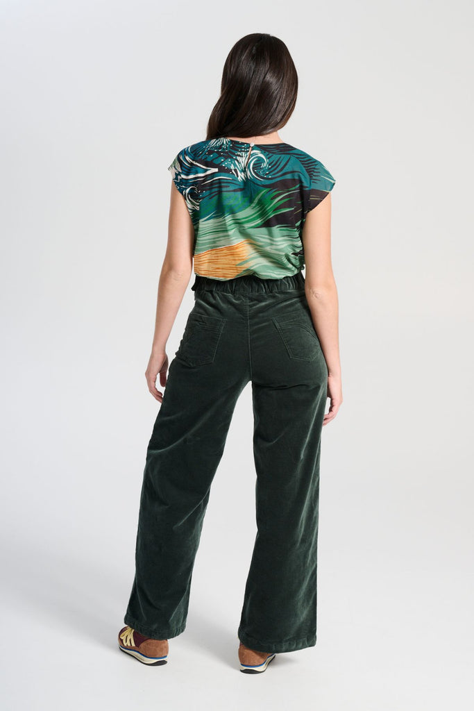 Olga de Polga best selling Forest Green Peggy Paris pants in soft velvet, long length. Comfy high waist, large pockets, side zip. Elastic back waist. Back view on model