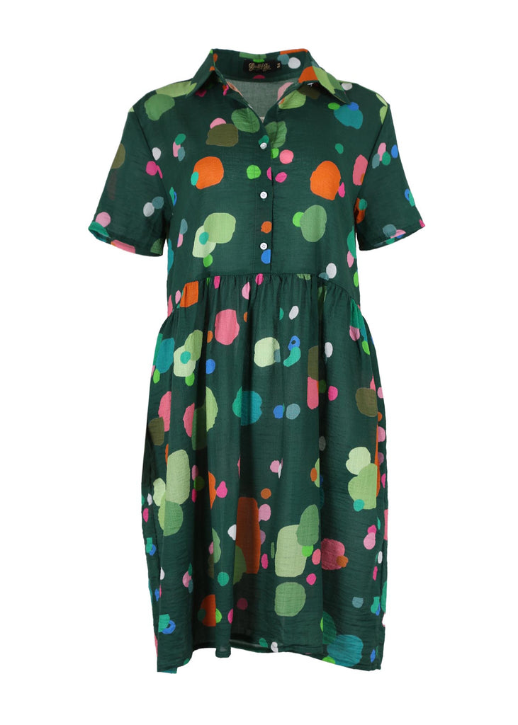 Olga de Polga Villa Drop Waist Dress in Green Astra printed cotton seersucker fabric. With short sleeves and a collar, with buttons down to the waist, and gathering from below the waist seam. Front view.