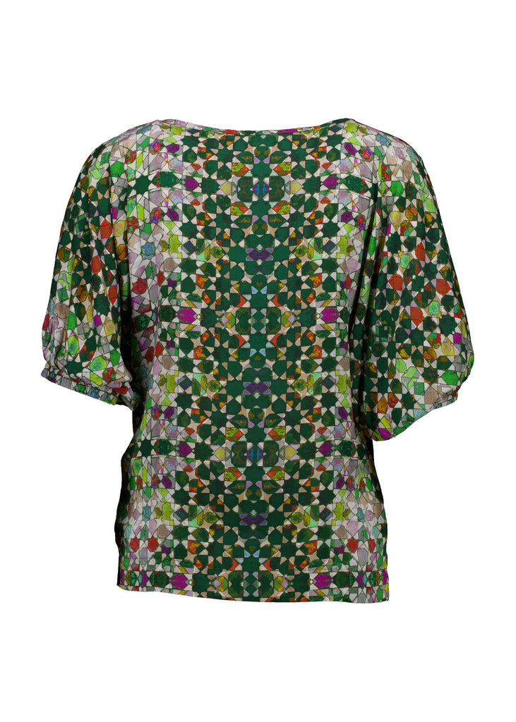 Olga de Polga Kaleidoscope Green Camisa Blouse in printed fine Tencel. This is a reversible top with the choice of a soft V-neck and a boat neck which are interchangeable. Half length sleeves. Finishes at the hip. Back view.