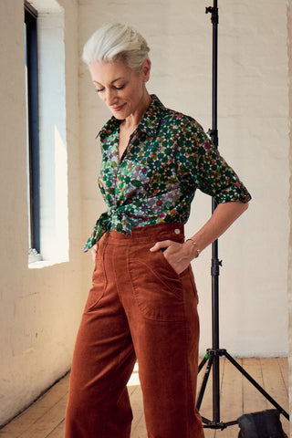 Olga de Polga Green Kaleidoscope cotton button-up shirt. Side front view on model