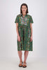 Olga de Polga Green Villa dress long in cotton Shirt dress with a button down front and short sleeves. Finishes just below the knee. Front view on model.