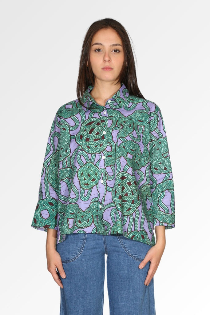 Olga de Polga green and lilac printed cotton women's shirt in a love knots pattern. Front view on model
