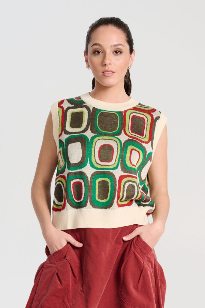 Olga de Polga Green knit vest with a retro pattern. Bristol Lush Knit Vest. Women's knitted vest in a soft merino wool blend. Front view on model