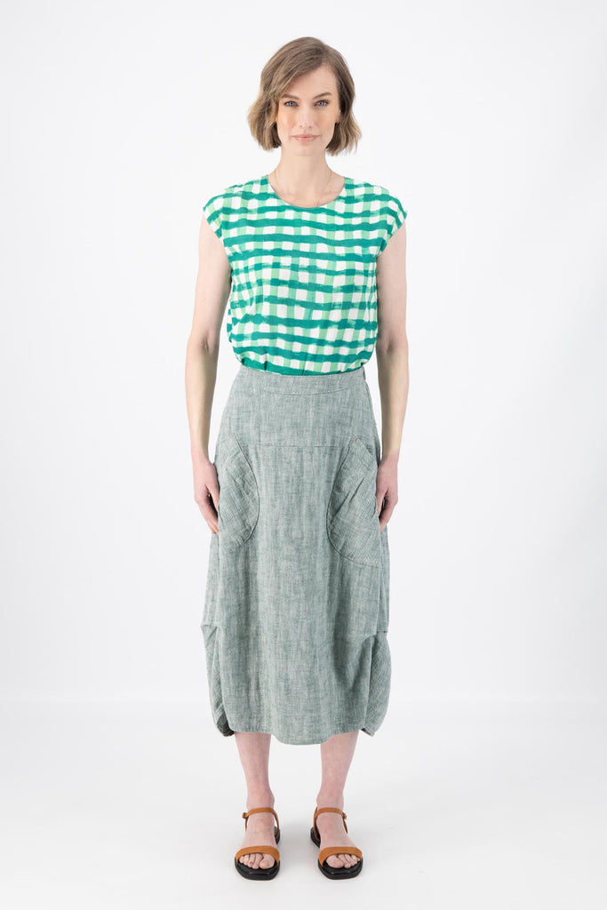 Olga de Polga Milwaukee Panorama woven skirt in Green. Our Milwaukee Skirt is an incredibly unique, chic and original skirt. It is universally flattering, highly versatile, and super comfortable. Perfect to throw on and go. Front view on model.