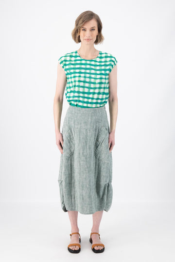 Olga de Polga Milwaukee Panorama woven skirt in Green. Our Milwaukee Skirt is an incredibly unique, chic and original skirt. It is universally flattering, highly versatile, and super comfortable. Perfect to throw on and go. Front view on model.