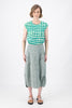 Olga de Polga Milwaukee Panorama woven skirt in Green. Our Milwaukee Skirt is an incredibly unique, chic and original skirt. It is universally flattering, highly versatile, and super comfortable. Perfect to throw on and go. Front view on model.