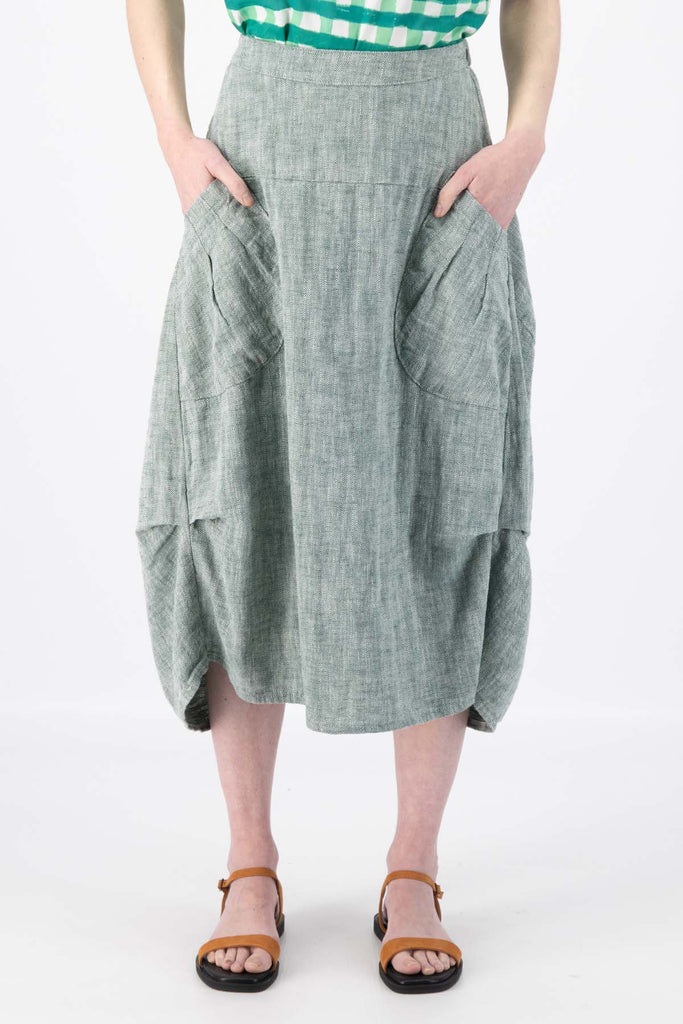 Olga de Polga Milwaukee Panorama woven skirt in Green. Our Milwaukee Skirt is an incredibly unique, chic and original skirt. It is universally flattering, highly versatile, and super comfortable. Perfect to throw on and go. Front close-up view on model.