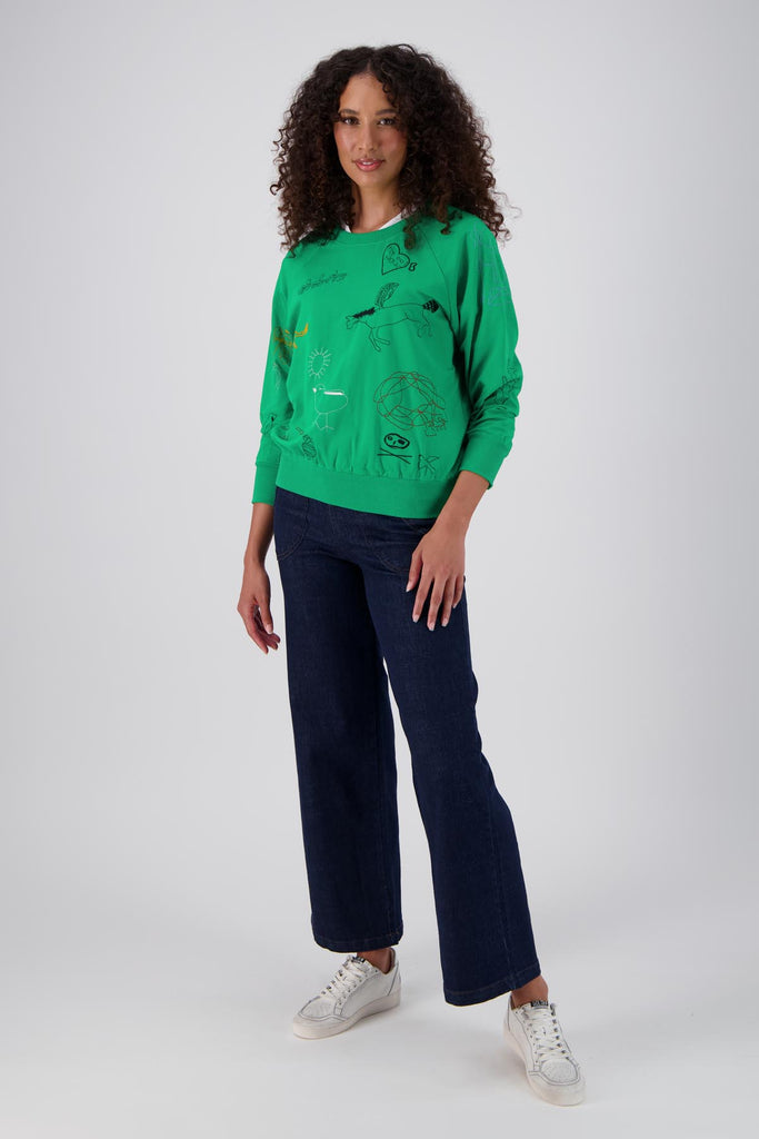 Olga de Polga Green Montage sweatshirt in a cotton tence blend. The sweatshirt has abstract embroidered motifs. Ribbing at the neckline, cuffs and hem add durability to the sweatshirt. Front full length view on model