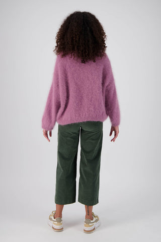 Olga de Polga Olive Green Fine Cord Peggy Pants. Cropped ankle length and large patch pockets, wit a side zip fastening. Our best selling pants.  Back full length view on model