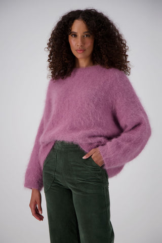 Olga de Polga Olive Green Fine Cord Peggy Pants. Cropped ankle length and large patch pockets, wit a side zip fastening. Our best selling pants.  Waist focus view on model