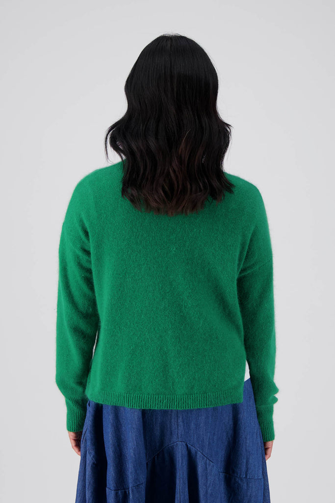 Olga de Polga's Portland sweater in Emerald green is made from a soft angora/wool mix.With a round neckline and a slightly cropped length, with long sleeves.  Back view