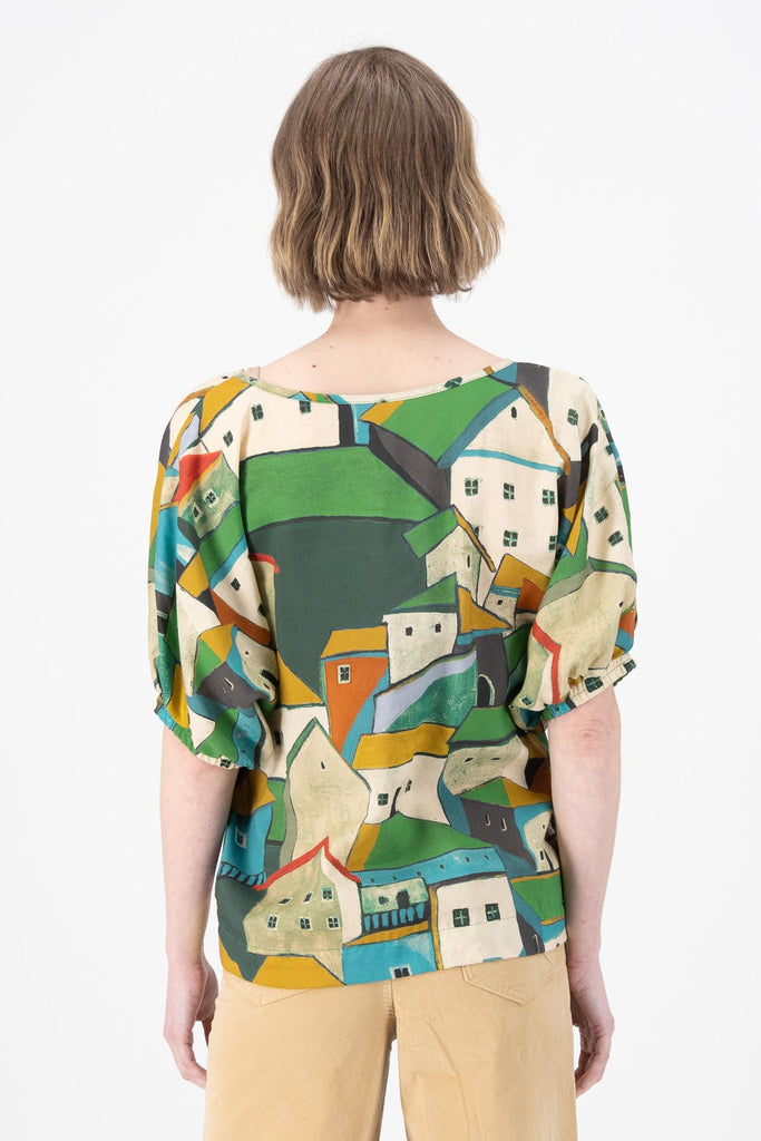 Olga de Polga Camisa batwing sleeved blouse in Pueblito Green printed Tencel. Back view on model.