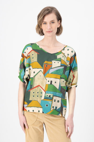 Olga de Polga Camisa batwing sleeved blouse in Pueblito Green printed Tencel. Front view on model.