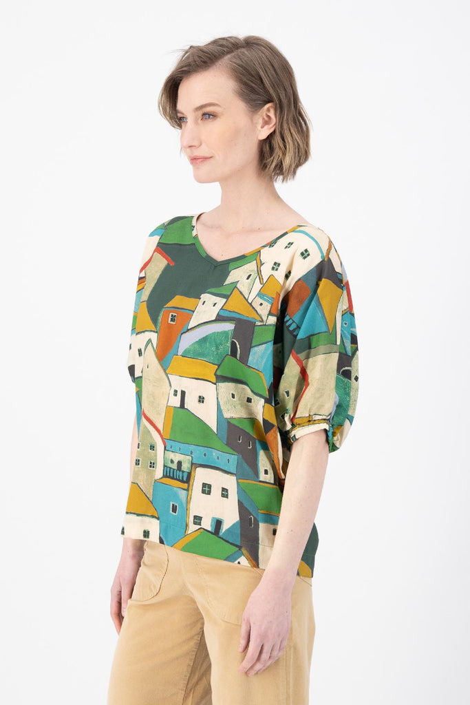 Olga de Polga Camisa batwing sleeved blouse in Pueblito Green printed Tencel. Side view on model.