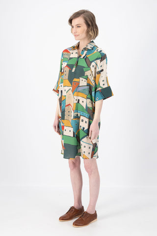 Olga de Polga Estilo shift dress in Pueblito Green printed Tencel mix fabric. Side front view on model.