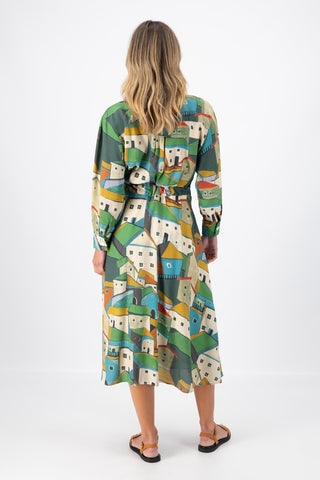 Olga de Polga Green Pueblito parisian wrap dress in 100% viscose with long sleeves and an elasticated back waist. Midi length. Back view on model.