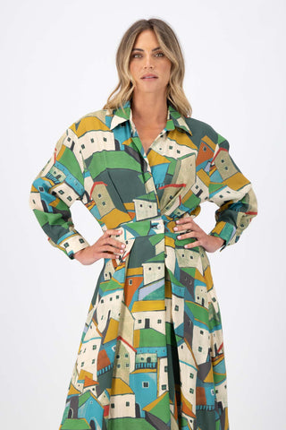 Olga de Polga Green Pueblito parisian wrap dress in 100% viscose with long sleeves and an elasticated back waist. Midi length. Front close up view on model.
