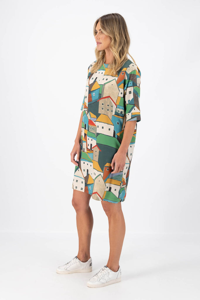 Olga de Polga Secillo shift dress in Pueblito Green printed Tencel mix fabric. Side view on model.