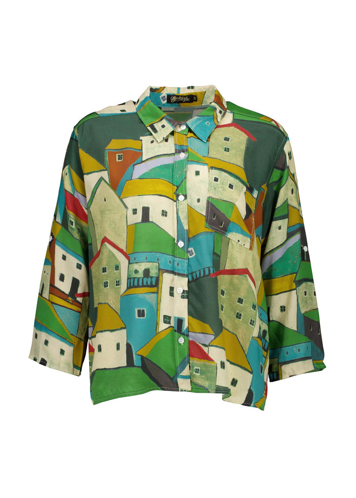 Green Pueblito printed viscose shirt with a button down front and 3/4 sleeves. Finishes at the hip. Front view.