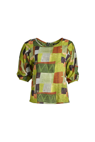 Olga de Polga classic blouse in green Kismet Sage printed cotton seersucker. The blouse features a beautifully detailed lantern sleeve with a drop shoulder and delicate pleating on the shoulder and cuff. It also has a wide boat neckline and invisible zip fastening at the back. Front view